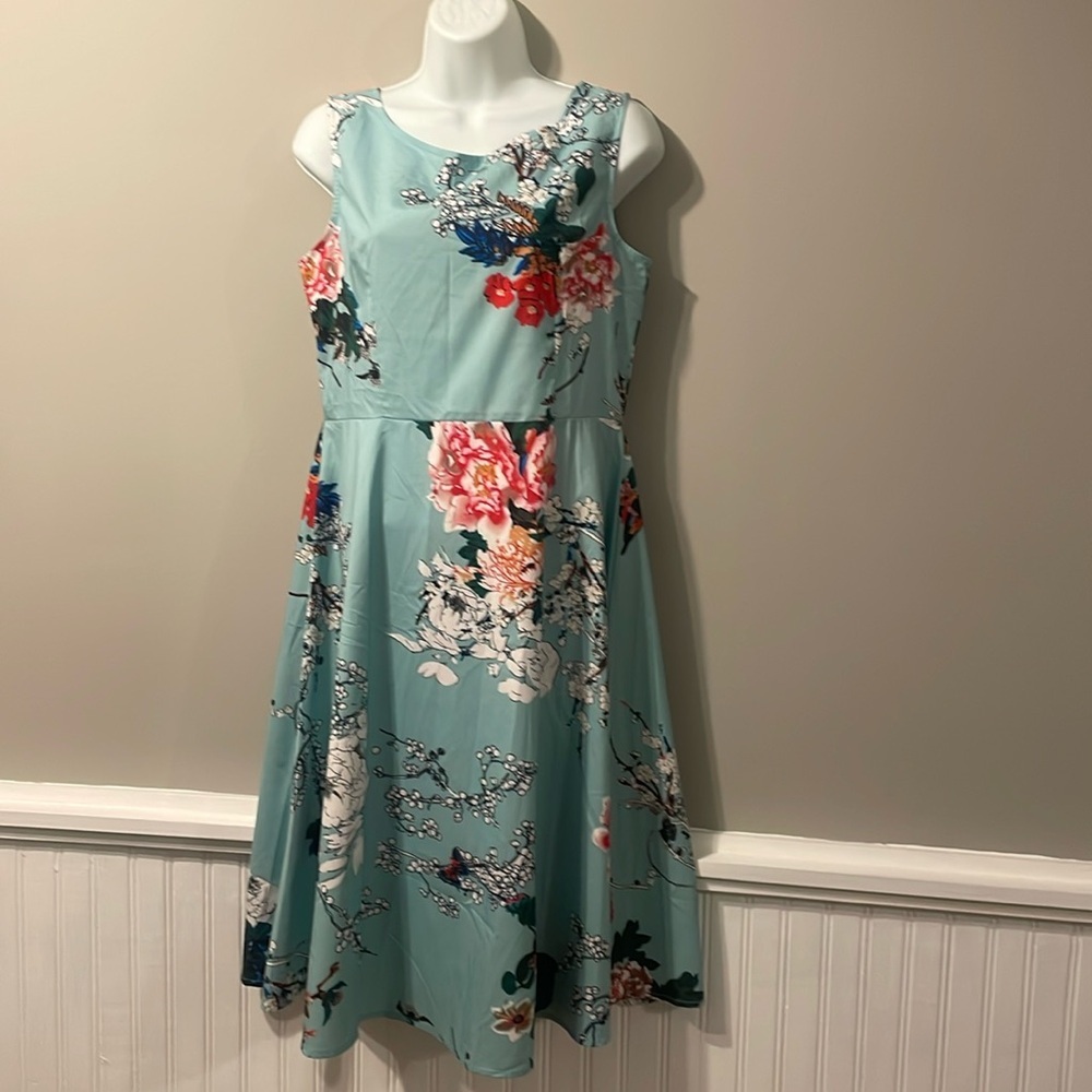 Floral teal torqouise sleeve less dress.. newwithouttag